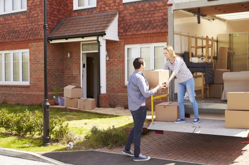Mover carrying a boxed item with protective handling measures