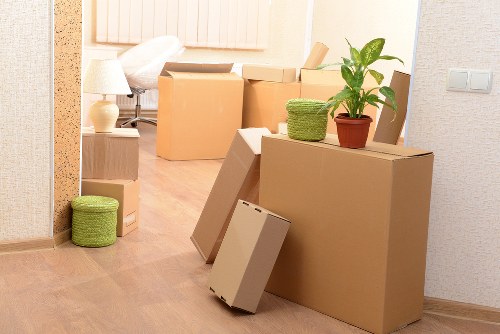 Professional removals service preparing items for transport